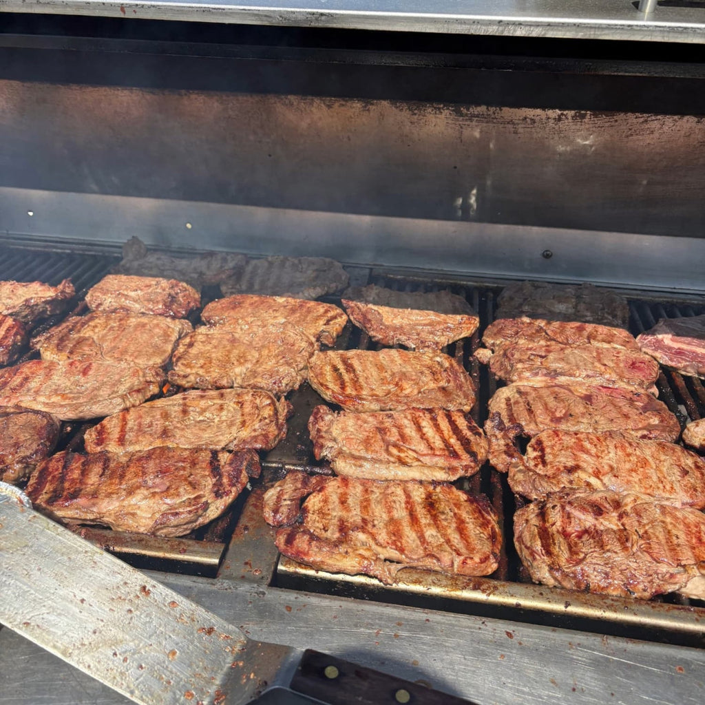Grilled meat on a barbecue grill with visible grill marks 2-in-1 Steak Seasoning & Meat Tenderizer
